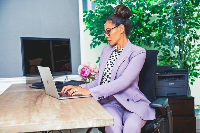 Erica working at her desk